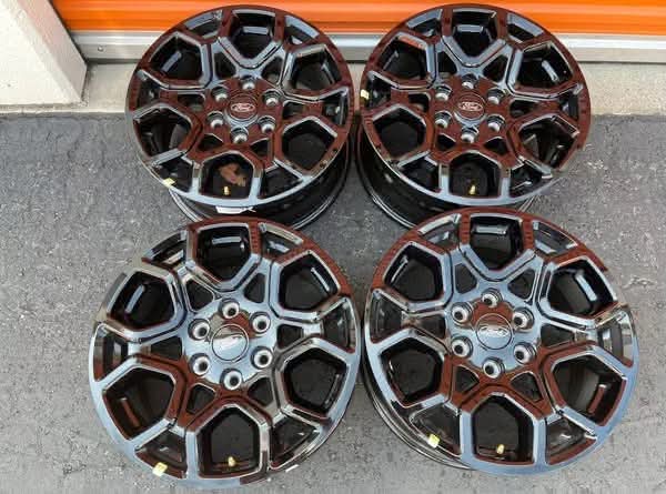 2024 Ford F-150 OEM 18" factory black wheels — set of four.